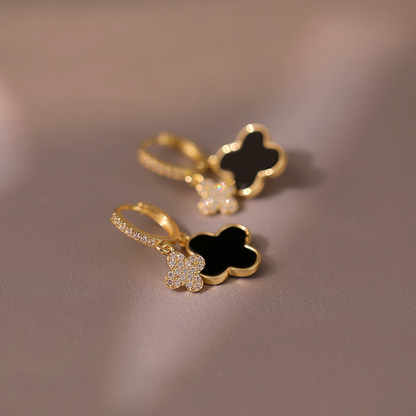 Lussuosi orecchini pendenti a trifoglio neri e dorati