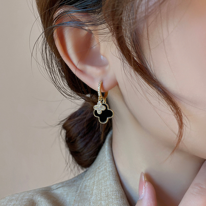 Lussuosi orecchini pendenti a trifoglio neri e dorati