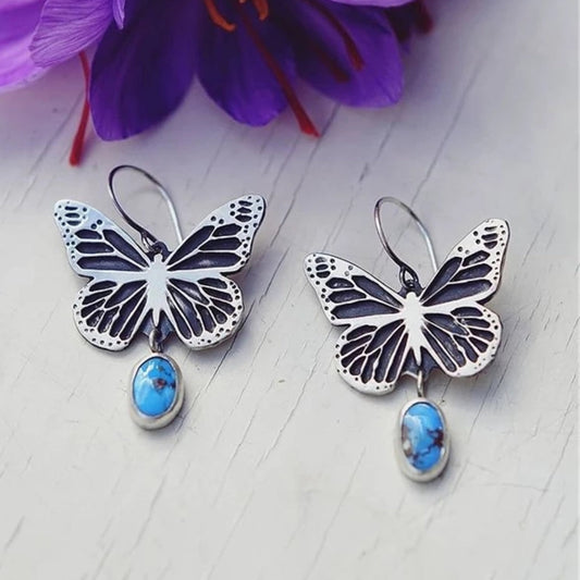 Orecchini vintage in argento con pietra blu a forma di farfalla