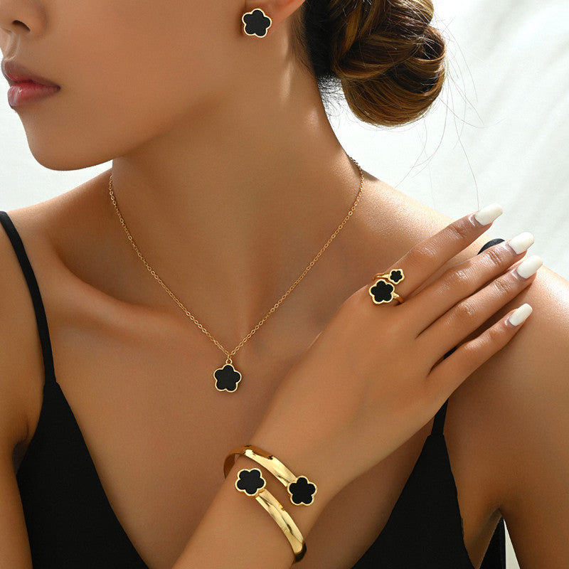 Elegante set di gioielli 4 pezzi con ciondoli neri e dorati