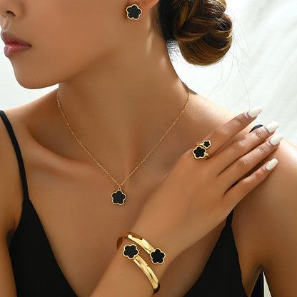 Elegante set di gioielli 4 pezzi con ciondoli neri e dorati